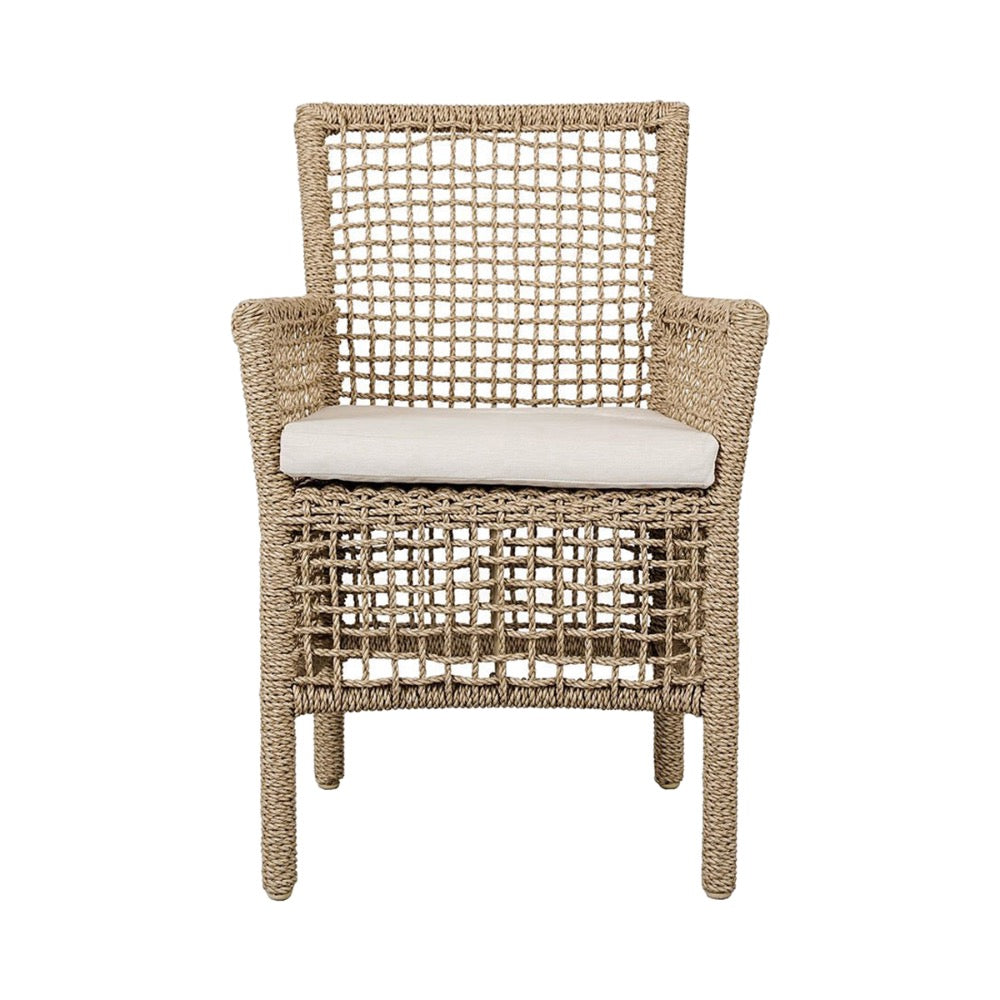 Woven chair with a white cushion on a white background
