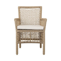 Woven chair with a white cushion on a white background