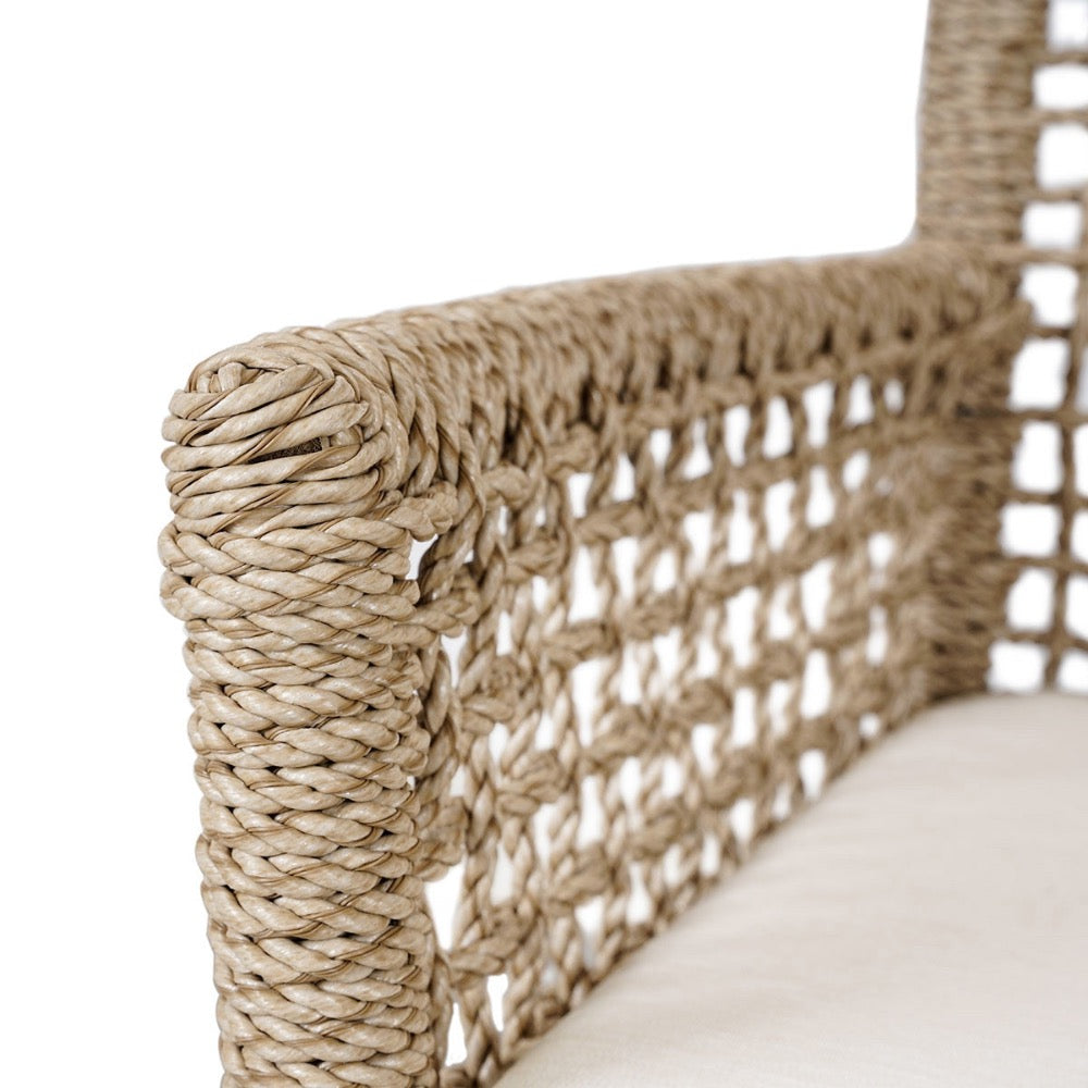 Close-up of a woven chair arm with natural fiber texture on a white background