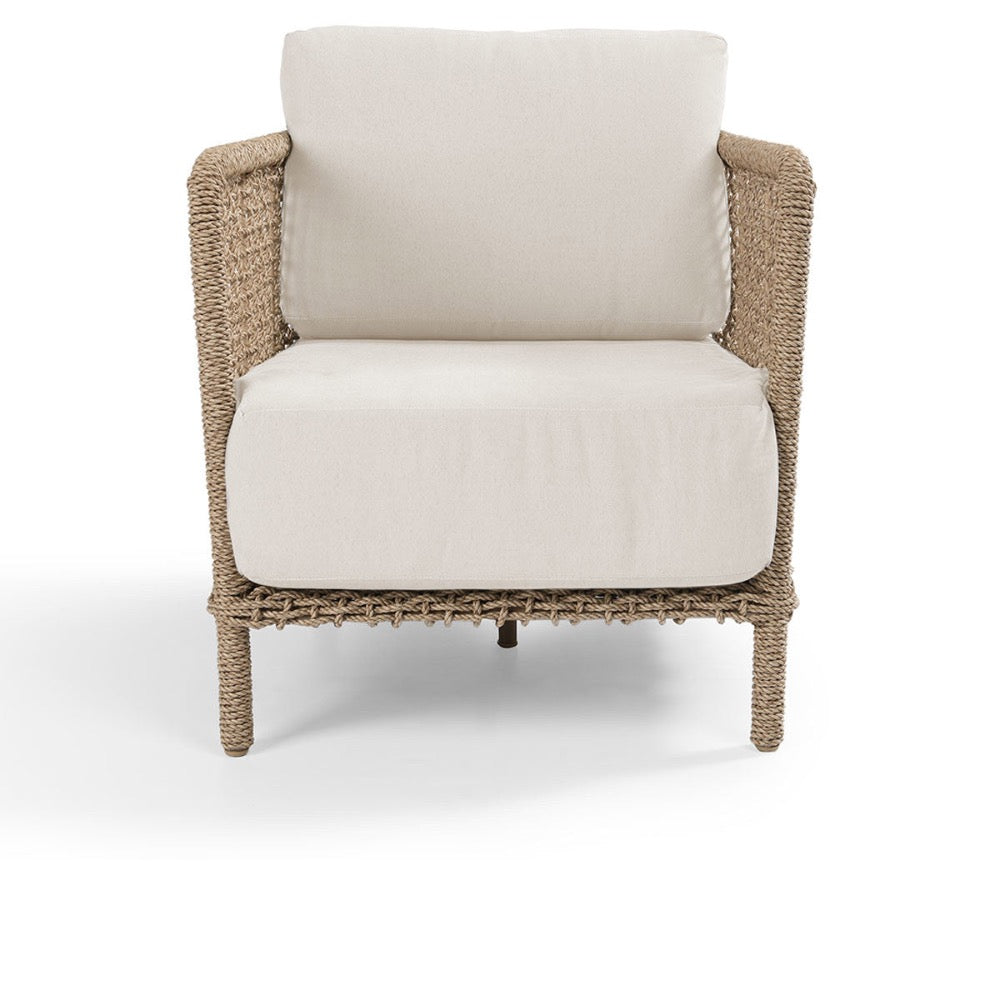Chair with woven frame and white cushion on a white background