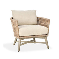 Wicker armchair with beige cushions on a white background