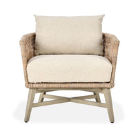 Wicker armchair with beige cushions on a white background
