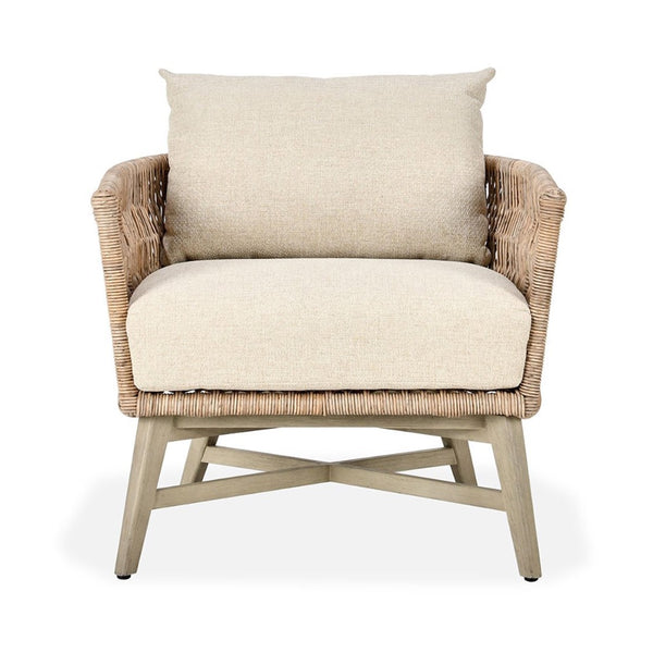 Wicker armchair with beige cushions on a white background