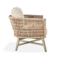 Wicker armchair with a cushion on a white background