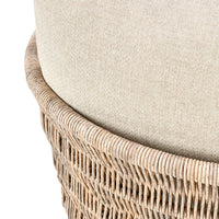 Close-up of a chair with wicker frame and beige cushion on a white background