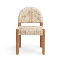 A modern accent chair featuring a natural woven seagrass or straw seat and backrest with a warm medium-brown wooden frame, shown against a plain white background.