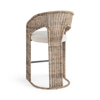 A tall wicker barstool with a curved backrest, woven natural-fiber frame, and a light beige upholstered seat on a white background.