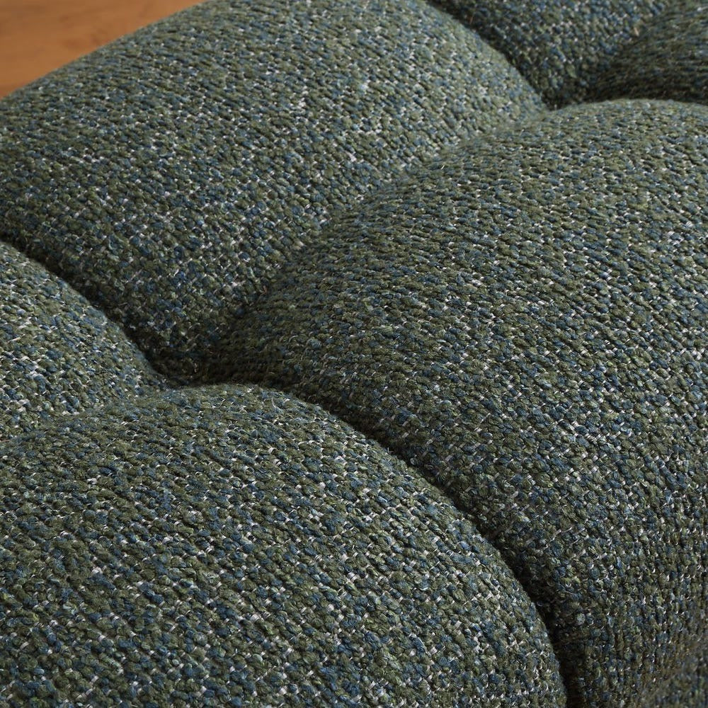 Close-up of a textured green fabric surface