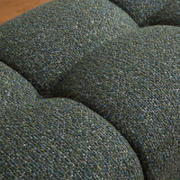 Close-up of a textured green fabric surface