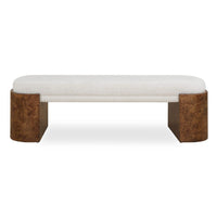 A modern upholstered bench with a light beige fabric seat and textured brown block legs, shown against a plain white background.