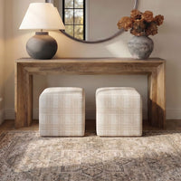 Wooden console table with decorative items in a room setting