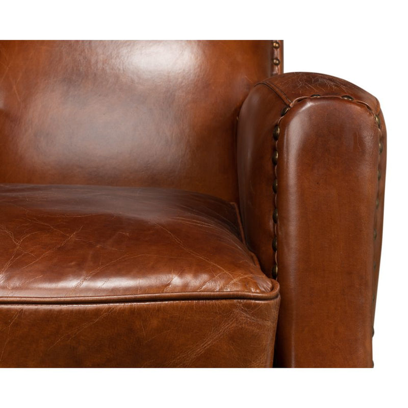 brown leather lounge chair nail heads