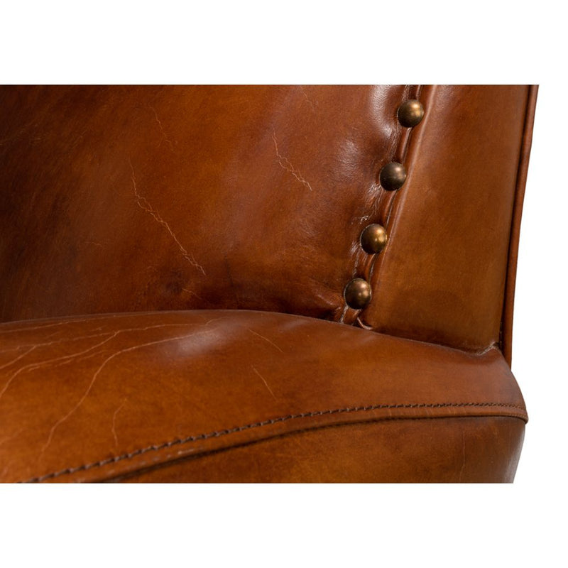 brown leather lounge chair nail heads