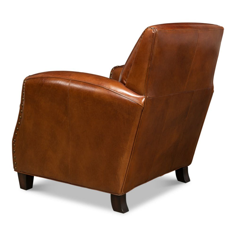 brown leather lounge chair nail heads