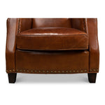 brown leather lounge chair nail heads