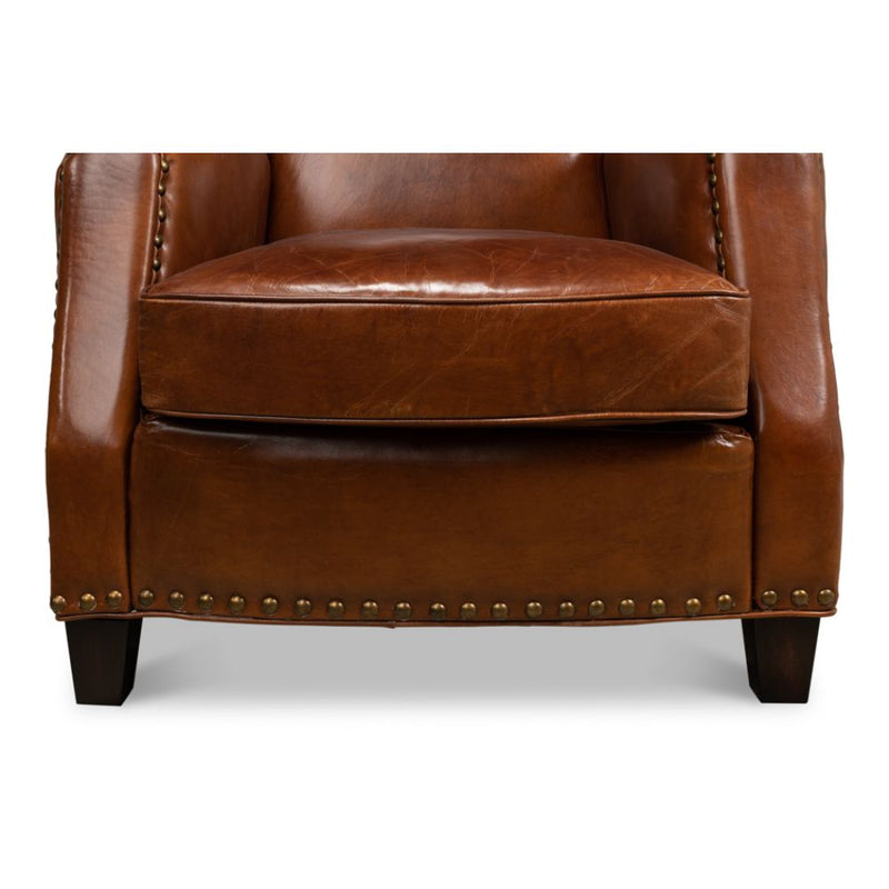 brown leather lounge chair nail heads