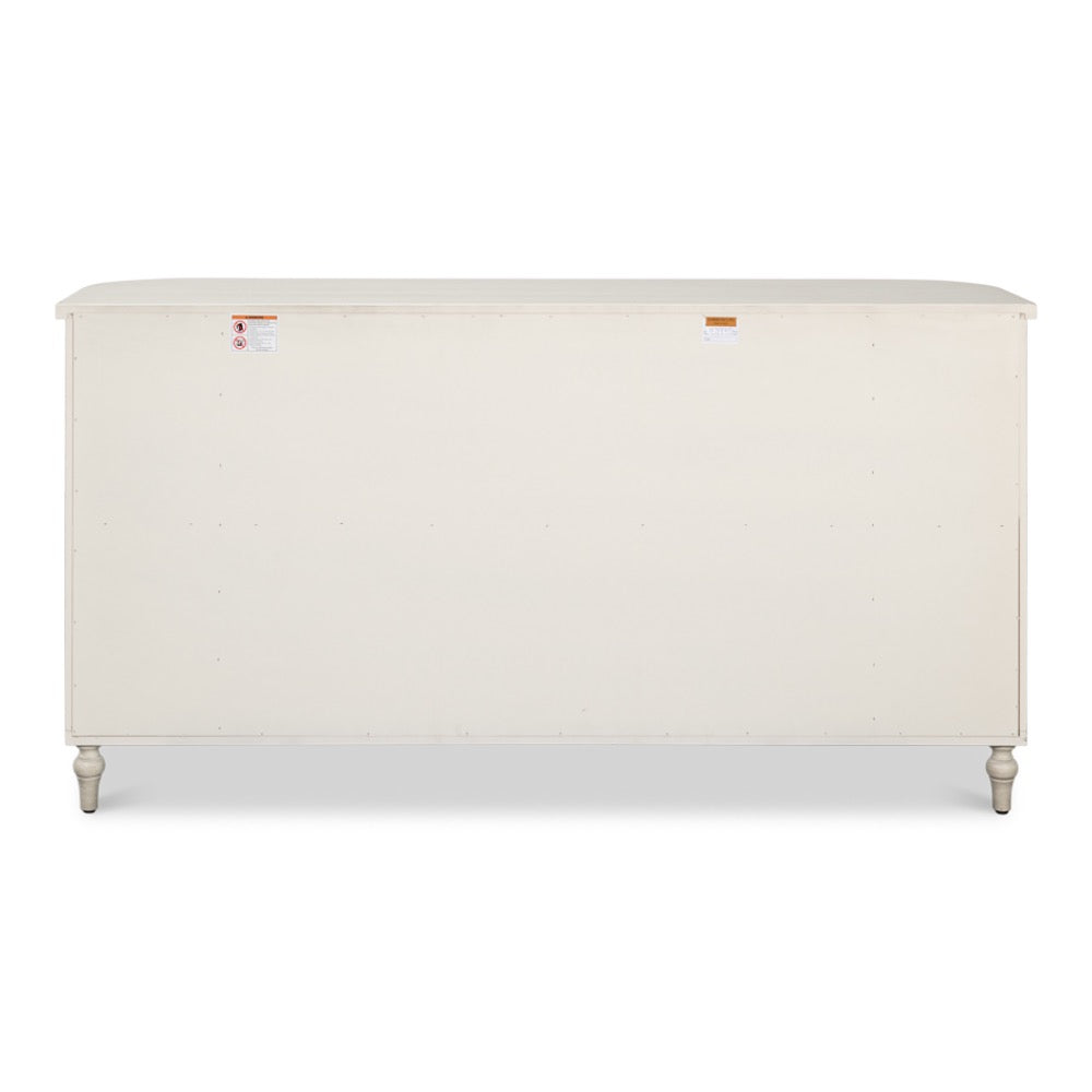 The back view of the Sarreid, Ltd. Charity Cane Sideboard shows short turned legs and safety labels on the upper corners.