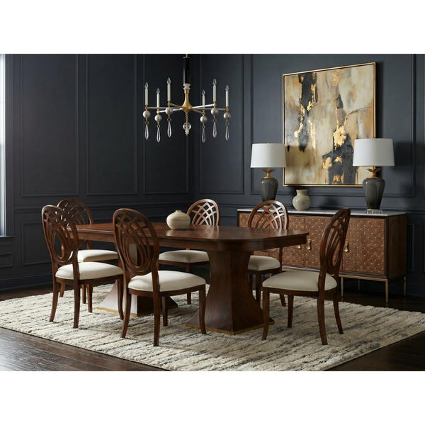 Dining room with wooden table and chairs, dark walls, and decorative elements.