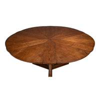 The Sarreid, Ltd. Casual Paldao Finish Medium Jupe Dining Table features a round top and geometric pedestal base.