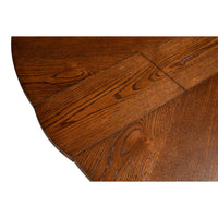 The Sarreid, Ltd. Casual Paldao Finish Medium Jupe Dining Table features a round top and geometric pedestal base.