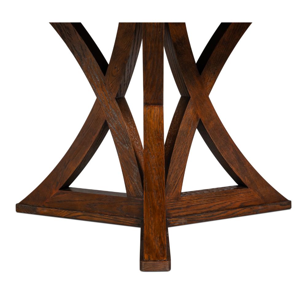 The Sarreid, Ltd. Casual Paldao Finish Medium Jupe Dining Table features a round top and geometric pedestal base.