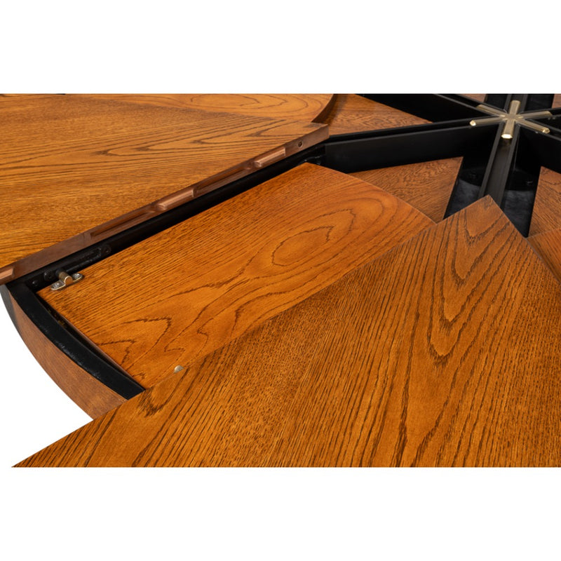 Close-up of the Sarreid, Ltd. Casual Tobacco Brown Finish Medium Jupe Dining Table with a partially opened leaf.