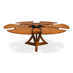 Sarreid, Ltd. Casual Tobacco Brown Finish Medium Jupe Dining Table with starburst design and partially extended leaves.