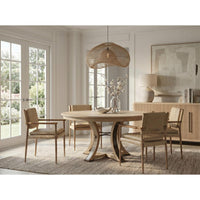 Dining room with wooden table and chairs in a bright room.