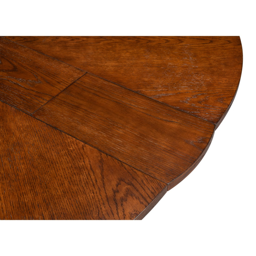 Close-up of a Sarreid, Ltd. Tower Palladio Finish Medium Jupe Dining Table showing seam and wood grain texture.