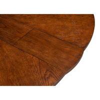 Close-up of a Sarreid, Ltd. Tower Palladio Finish Medium Jupe Dining Table showing seam and wood grain texture.