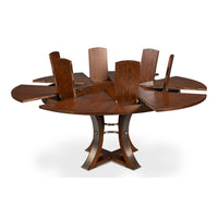Sarreid, Ltd. Tower Palladio Finish Medium Jupe Dining Table with extendable panels and partially opened leaf inserts.