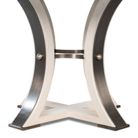 Curved metal and wood legs cross in an X under the Tower Working Jupe Table by Sarreid, Ltd., perfect for dining spaces.
