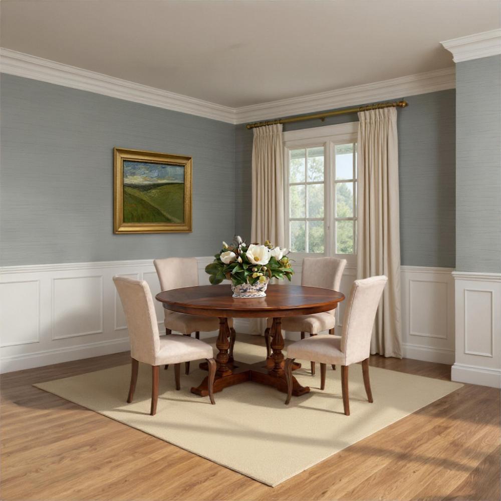 Dining room with wooden table and chairs, floral arrangement, and framed painting on gray wall.