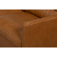 close up of brown leather rounded arm rest 