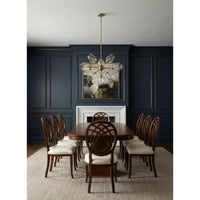 Dining room with wooden table and chairs against a dark blue wall.