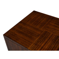 Close-up of a dark brown wood grain surface with a parquet-style inlay pattern, shown against a plain white background.