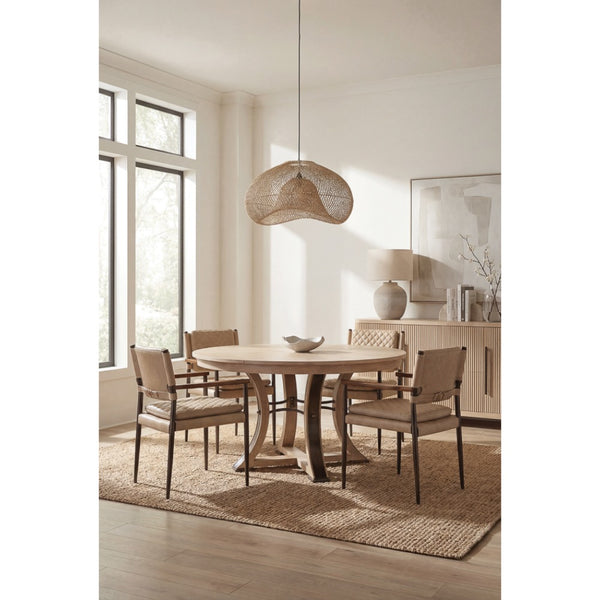 Dining room with wooden table and chairs, large windows, and a woven pendant light.