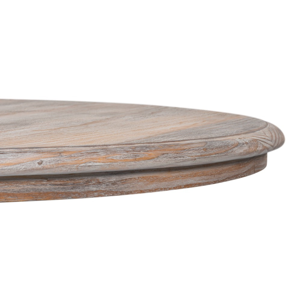 Close-up of a round wooden table top with a distressed, weathered finish showing natural wood grain and light brown tones, isolated on a white background.