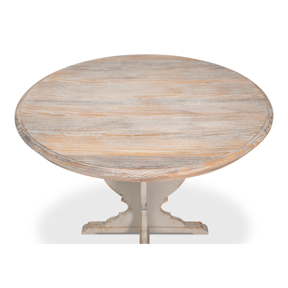 Round wooden table with a light finish on a white background