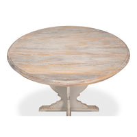 Round wooden table with a light finish on a white background