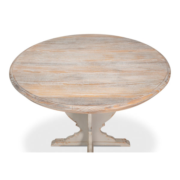 Round wooden table with a light finish on a white background