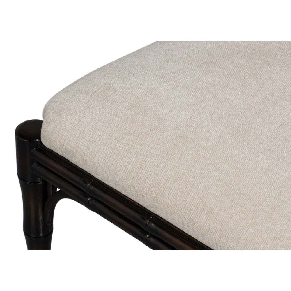 Chair with dark wooden frame and beige cushion on a white background