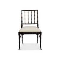 A dark wood dining chair with a curved bamboo-style backrest and a light beige upholstered seat cushion, shown against a plain white background.