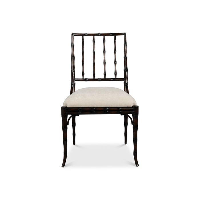 A dark wood dining chair with a curved bamboo-style backrest and a light beige upholstered seat cushion, shown against a plain white background.