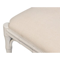 Beige upholstered bench with a white wooden frame on a white background