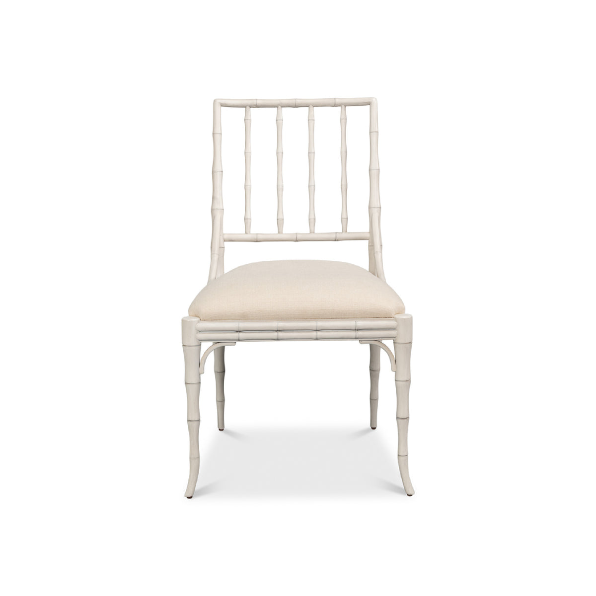A single dining chair with a white faux-bamboo frame and a cream upholstered seat cushion, shown against a plain white background.