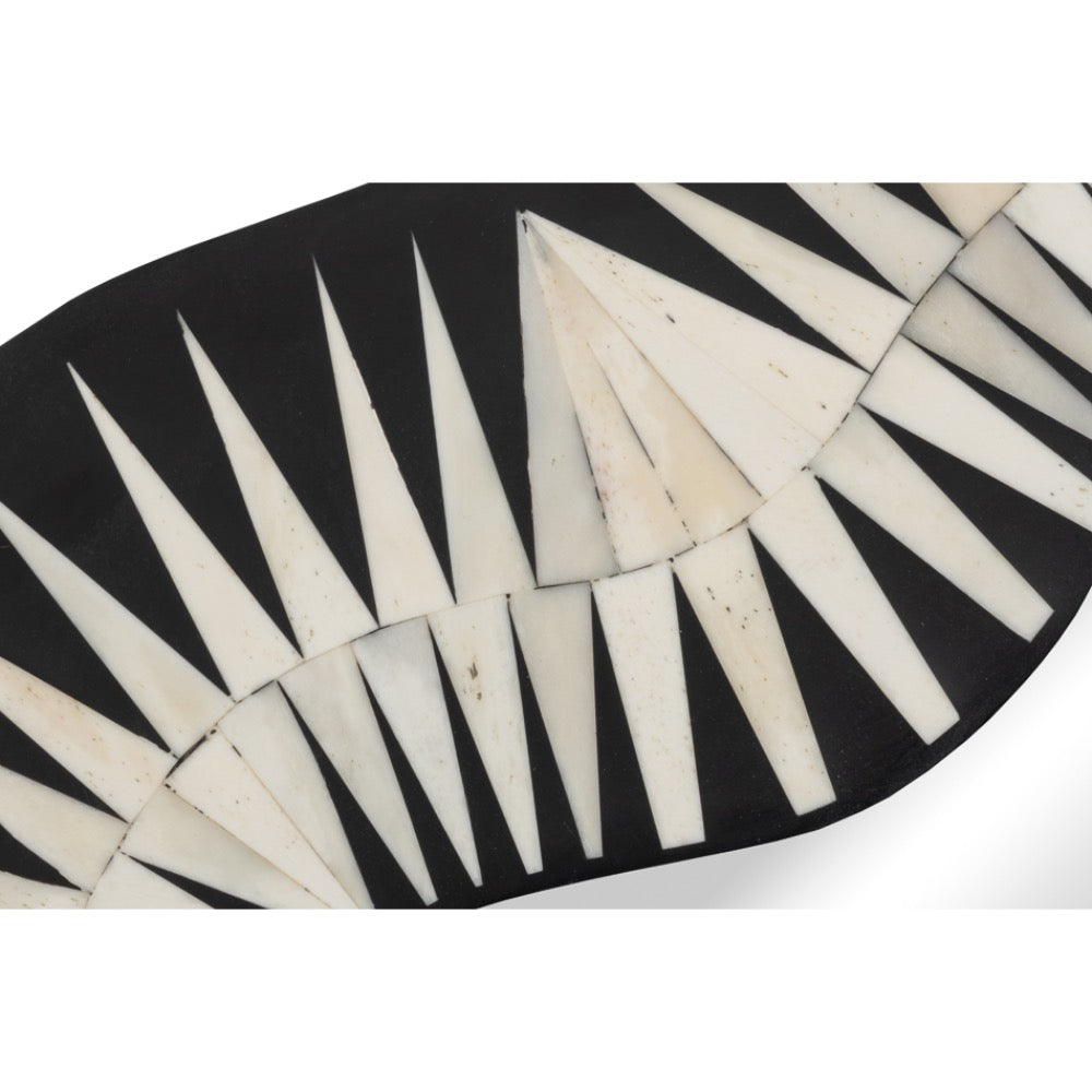 close up wall mirror with black and white geometric pattern