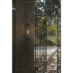 black iron 1-light outdoor wall sconce seeded glass scroll top