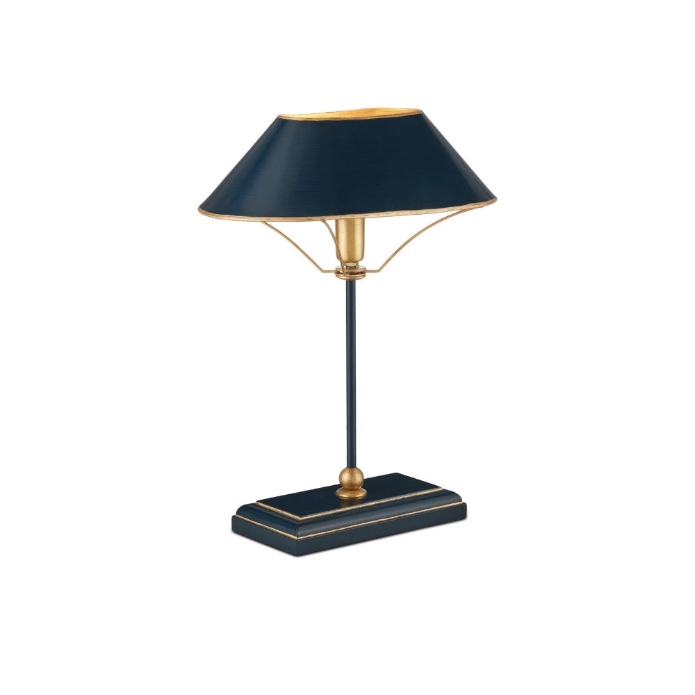 A modern table lamp with a dark navy blue shade and base accented by gold metal details, set against a plain white background.
