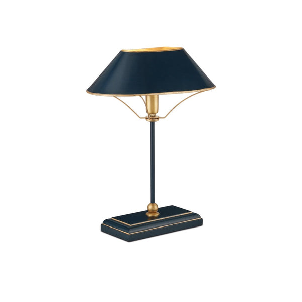 A modern table lamp with a dark navy blue shade and base accented by gold metal details, set against a plain white background.